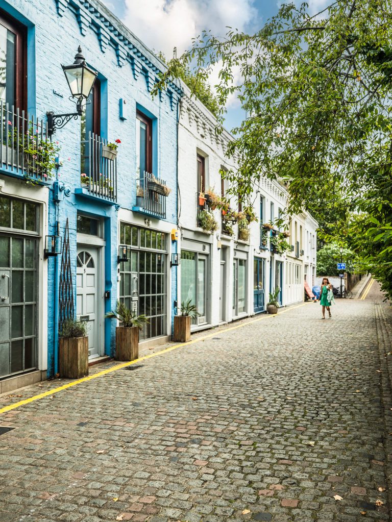 A beautiful West London mews with brightly coloured houses and cobbled street