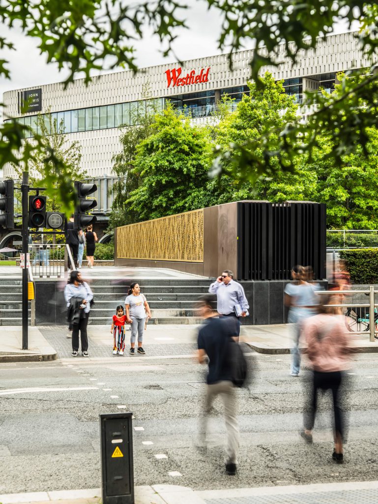 A road crossing with Westfield White City in the background