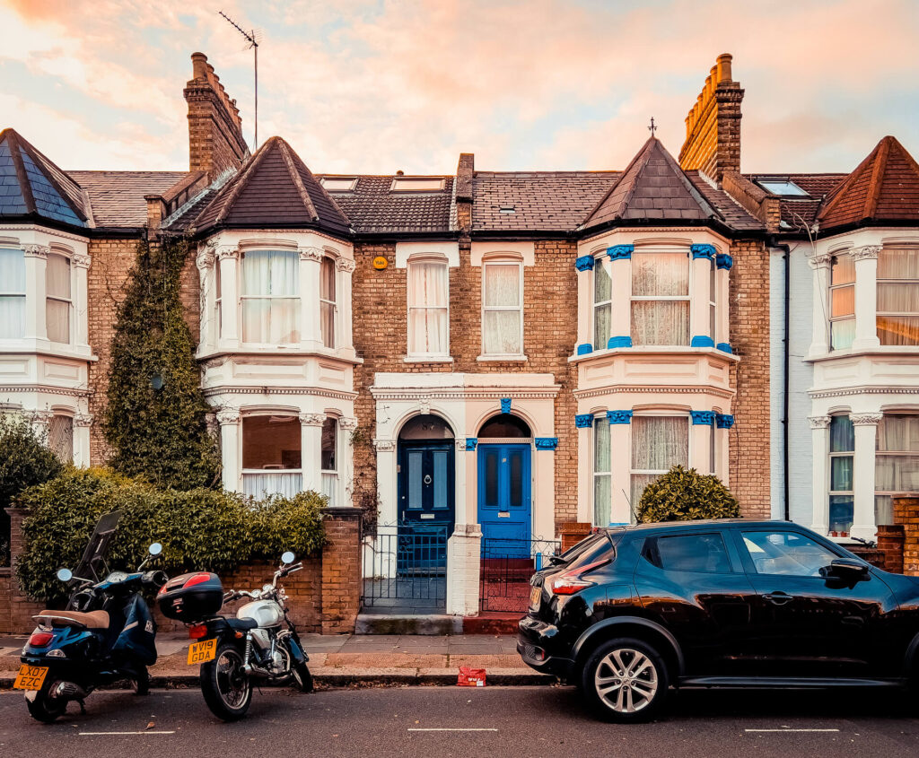 Two houses in W12 with identical blue front doors