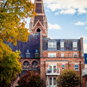 West Kensington house with two balconies with a church spire in the background