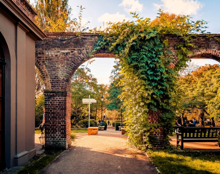 Brick archway in a leafy garden in Kensington